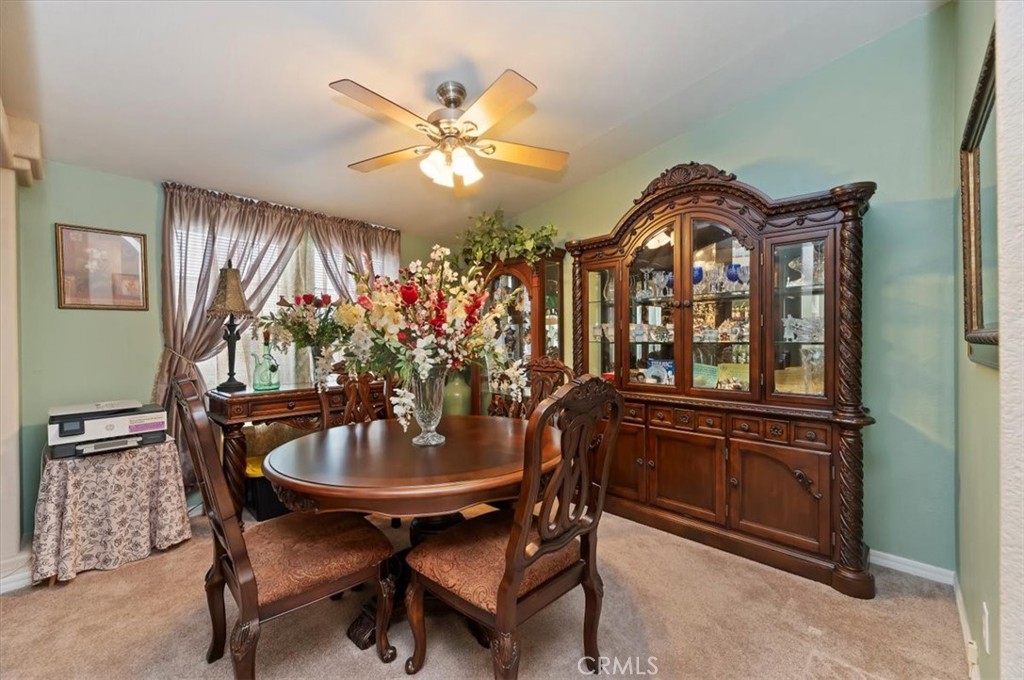 31130 South General Kearny Road, Unit 147 Temecula, CA 92591 - Photo 4 of 42 a view of a dining room with furniture and chandelier