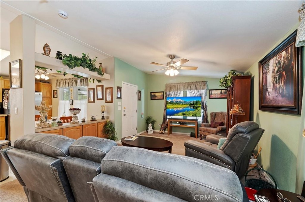 31130 South General Kearny Road, Unit 147 Temecula, CA 92591 - Photo 6 of 42 a living room with furniture and a large mirror