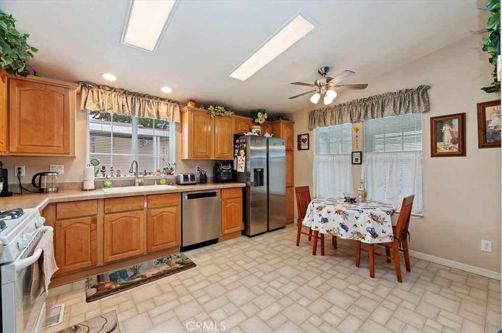 31130 South General Kearny Road, Unit 147 Temecula, CA 92591 - Photo 8 of 42 a kitchen with granite countertop furniture a dining table and chairs