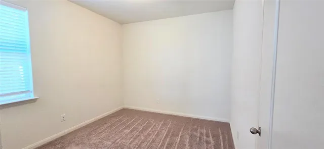 a view of a room that has a window in it