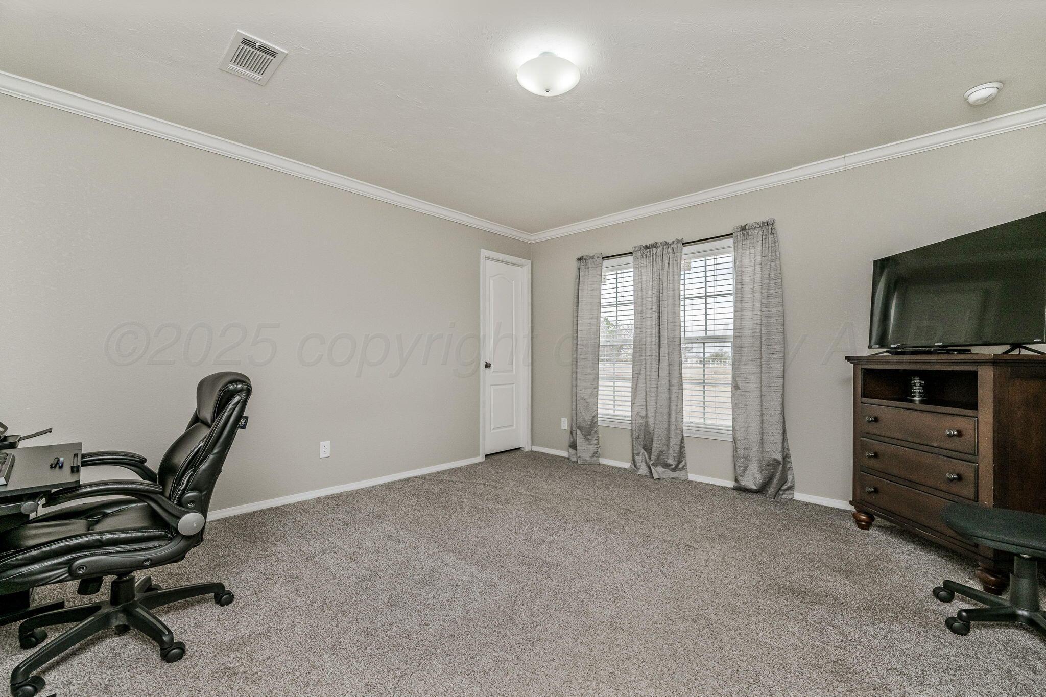 441 West Plantation Road Amarillo, TX 79118 - Photo 14 of 25 a view of a workspace with furniture and a window