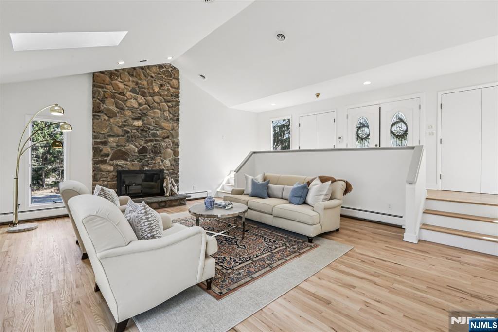 11 Carlough Road Upper Saddle River, NJ 07458 - Photo 7 of 41 a living room with furniture and a fireplace