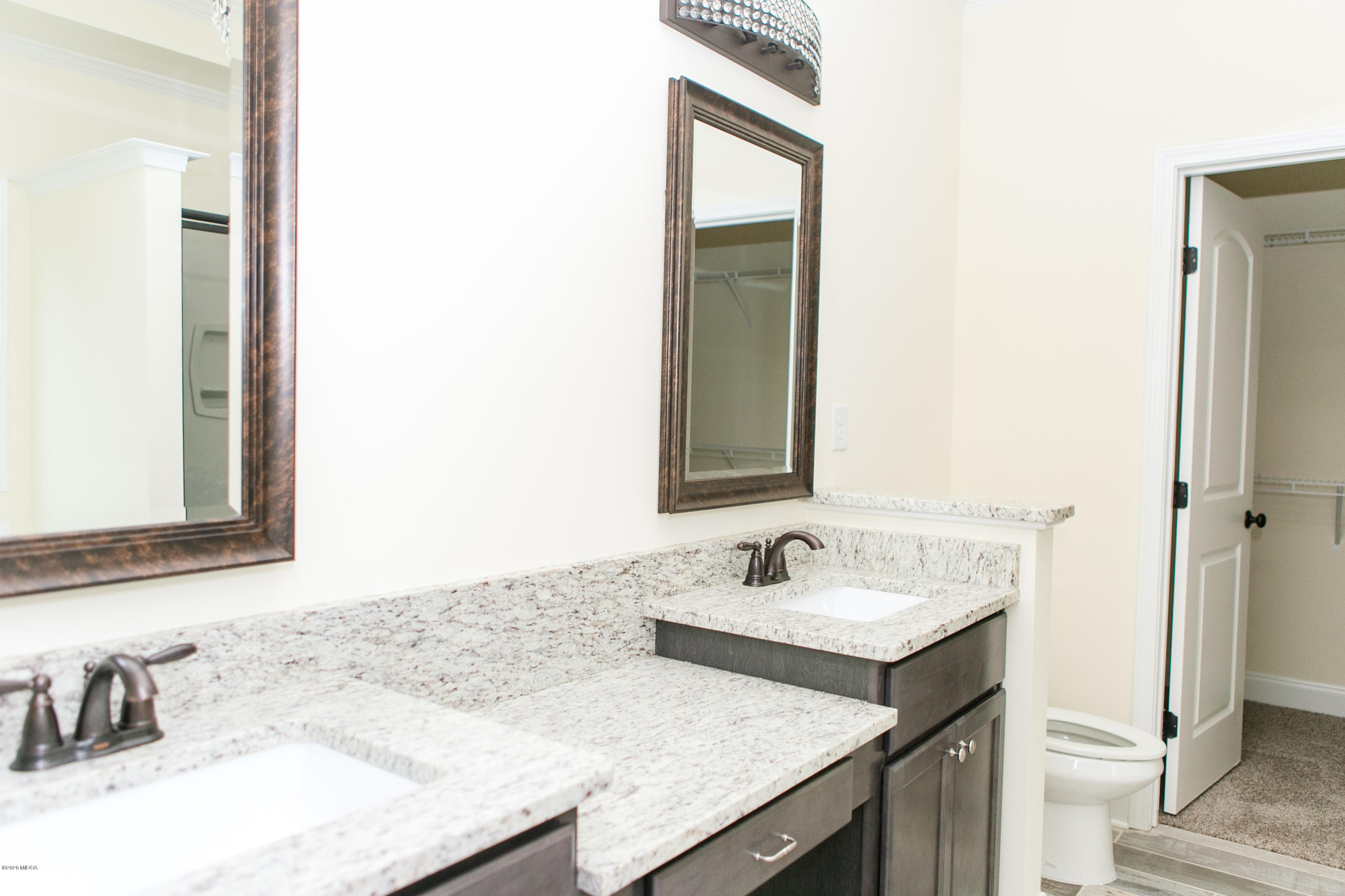 333 Walnut Grove Road Gray, GA 31032 - Photo 14 of 27 a bathroom with a granite countertop sink and a mirror