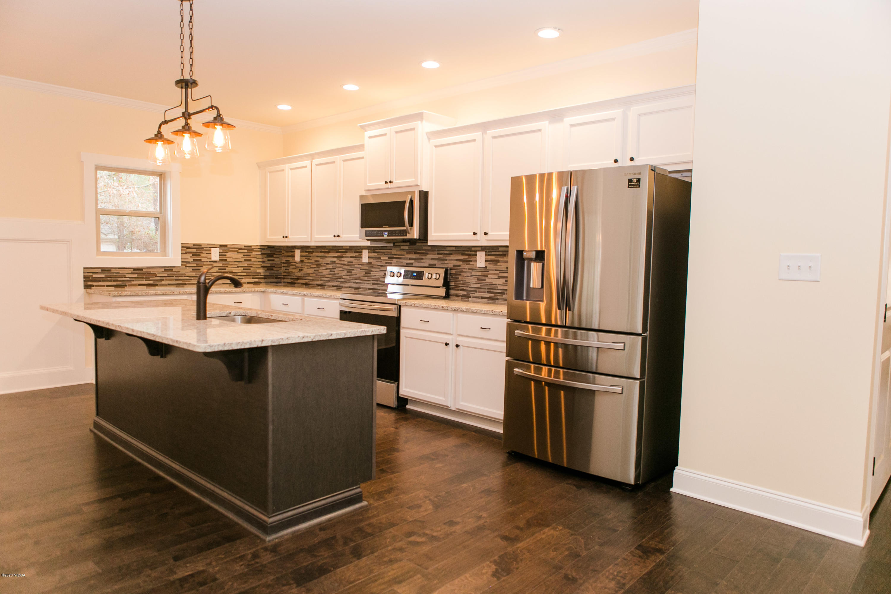 333 Walnut Grove Road Gray, GA 31032 - Photo 8 of 27 a kitchen with stainless steel appliances granite countertop a refrigerator a sink a stove a microwave and island