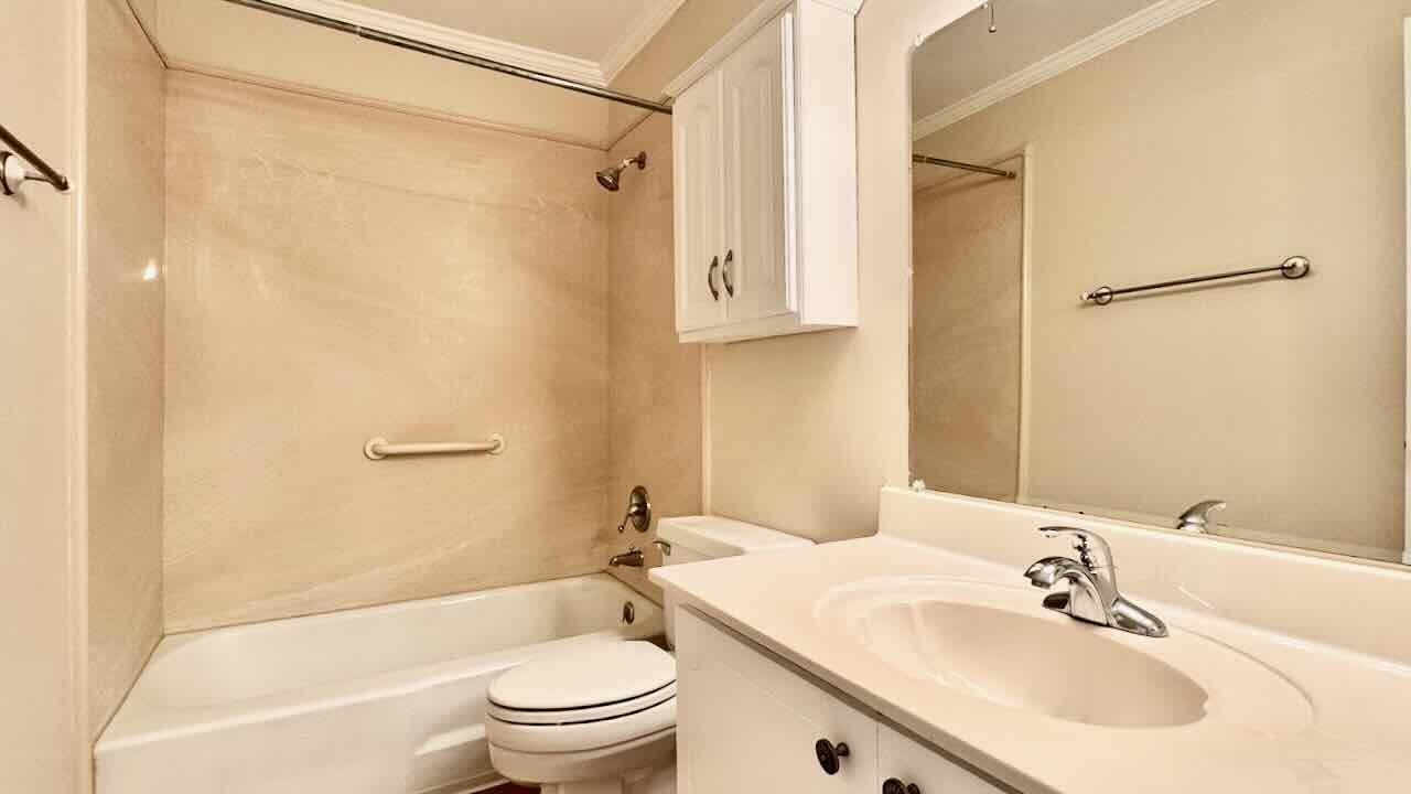 5718 Quince Road, Unit 10 Memphis, TN 38119 - Photo 15 of 28 Bathroom with tub / shower combination, vanity, and crown molding