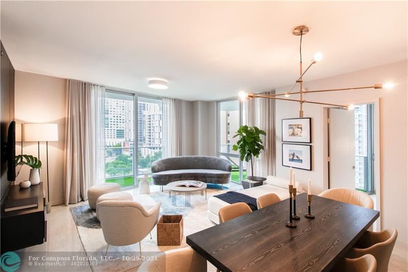 1010 Southwest 2nd Avenue, Unit 804 Miami, FL 33130 - Photo 2 of 12 a living room with furniture a window and a potted plant