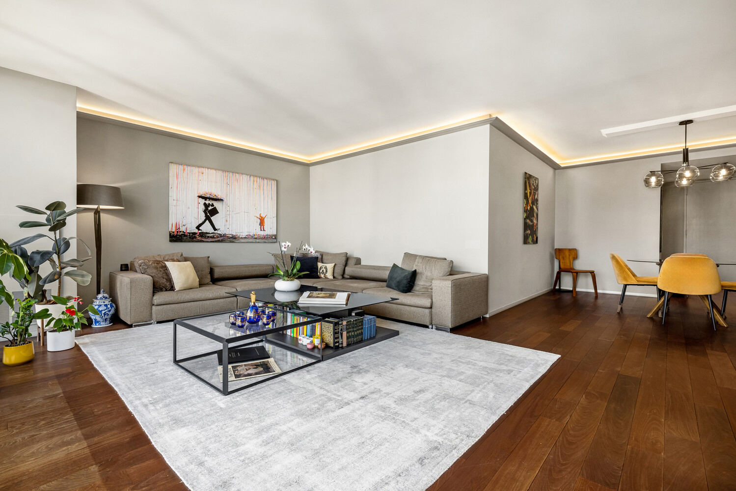 641 5th Avenue, Unit 34B Manhattan, NY 10022 - Photo 3 of 12 a living room with furniture and a table