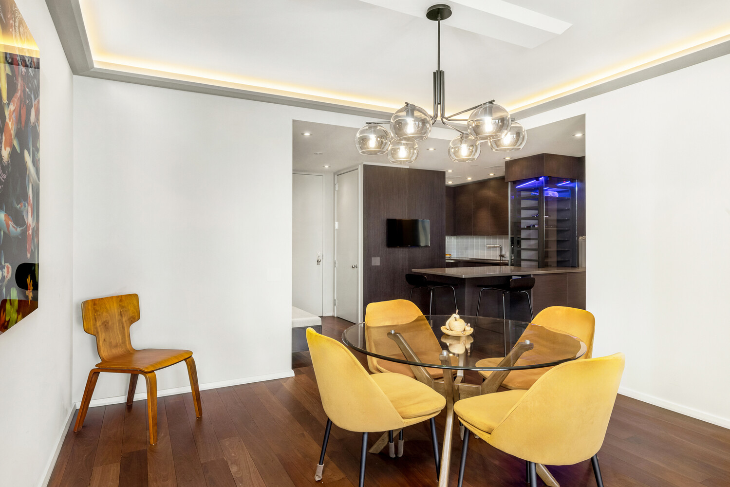 641 5th Avenue, Unit 34B Manhattan, NY 10022 - Photo 6 of 12 a view of a dining room with furniture and wooden floor
