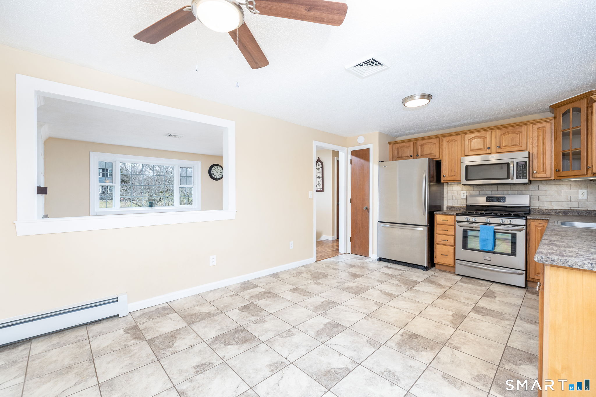 8 Still Field Road Manchester, CT 06040 - Photo 12 of 38 a kitchen with stainless steel appliances cabinets and window