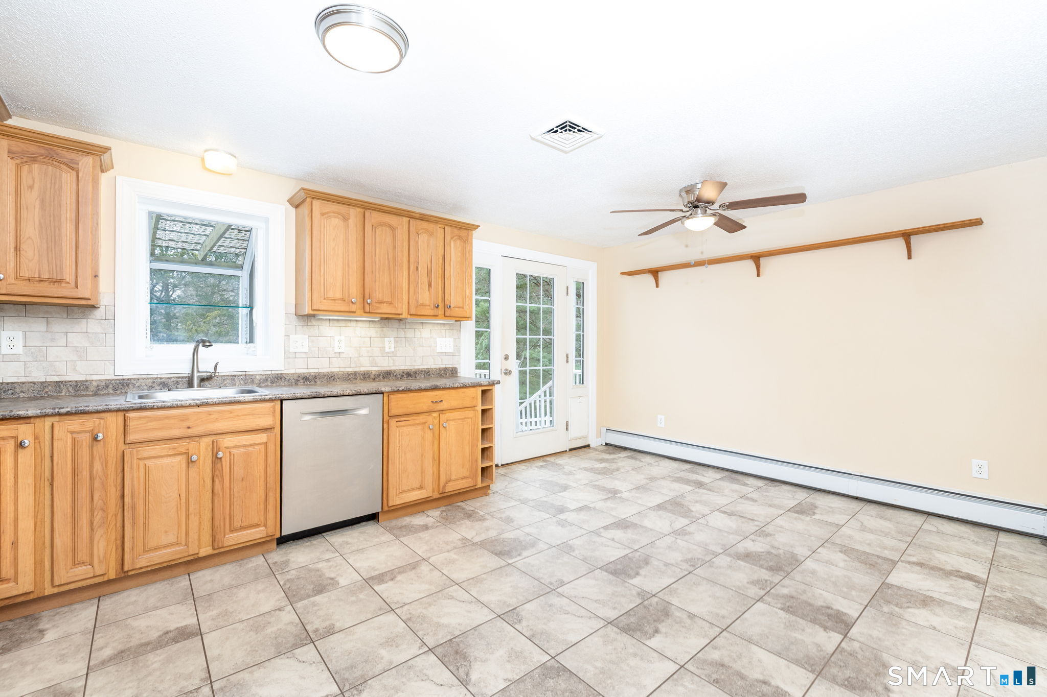 8 Still Field Road Manchester, CT 06040 - Photo 15 of 38 a kitchen with granite countertop a sink cabinets and window