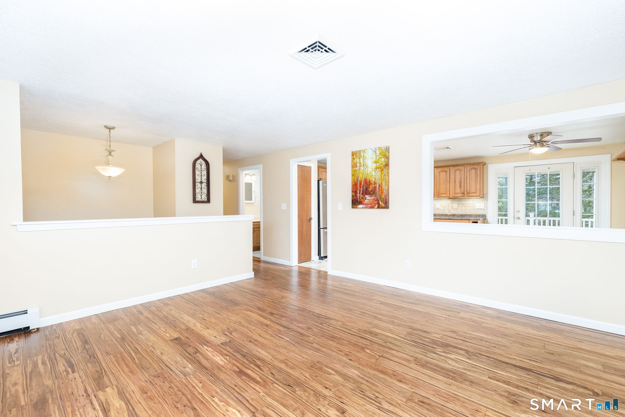 8 Still Field Road Manchester, CT 06040 - Photo 17 of 38 a view of an empty room with wooden floor and a window