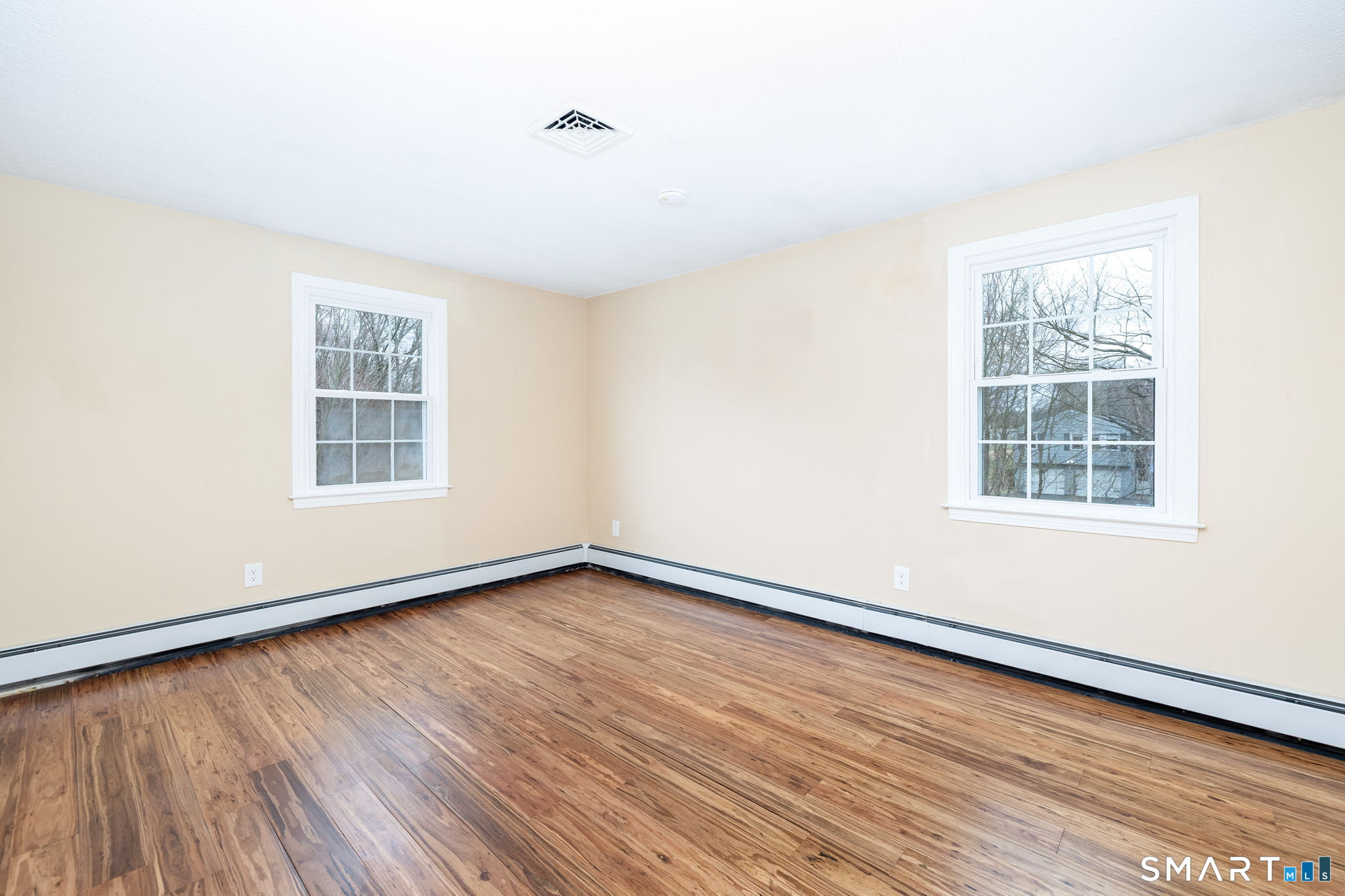 8 Still Field Road Manchester, CT 06040 - Photo 21 of 38 an empty room with wooden floor and windows