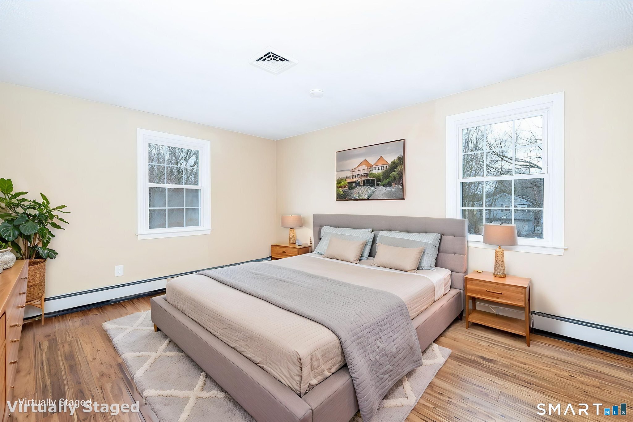 8 Still Field Road Manchester, CT 06040 - Photo 22 of 38 a bedroom with a bed and a potted plant