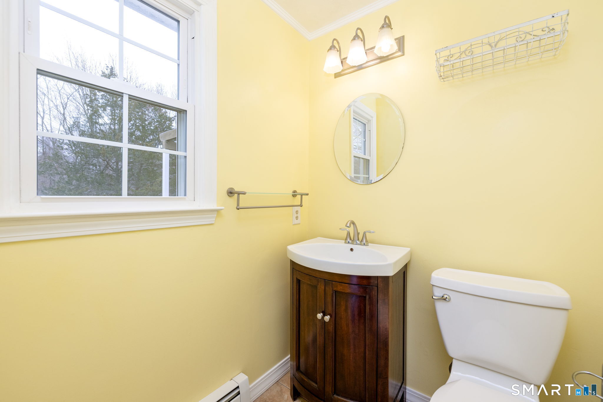 8 Still Field Road Manchester, CT 06040 - Photo 23 of 38 a bathroom with a toilet a sink and a mirror