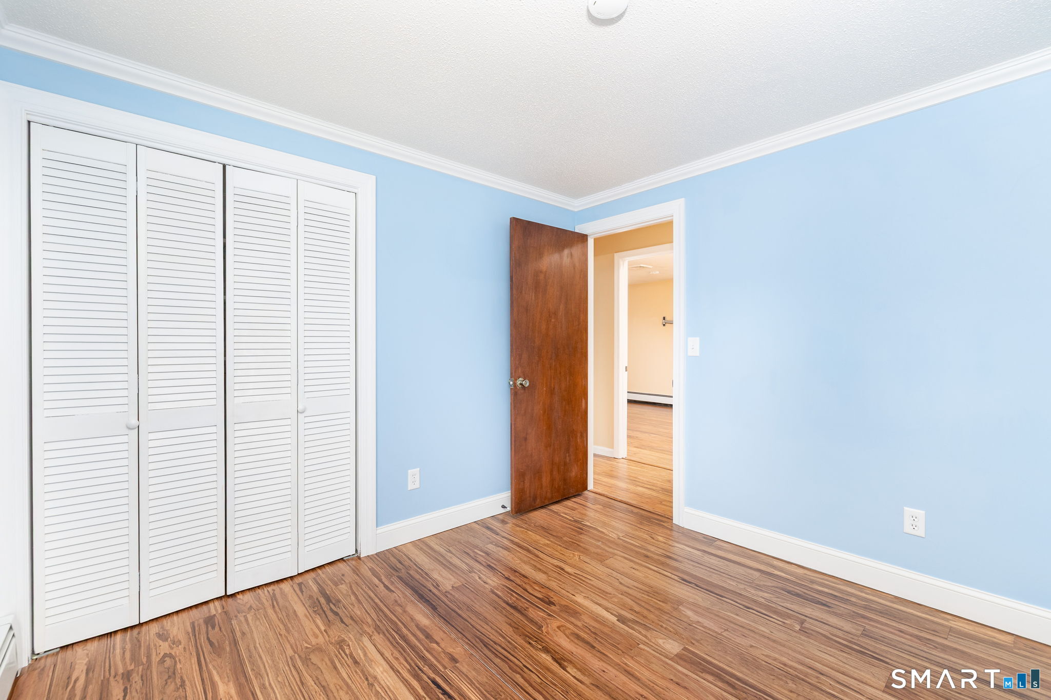 8 Still Field Road Manchester, CT 06040 - Photo 24 of 38 a view of an empty room with wooden floor and a window