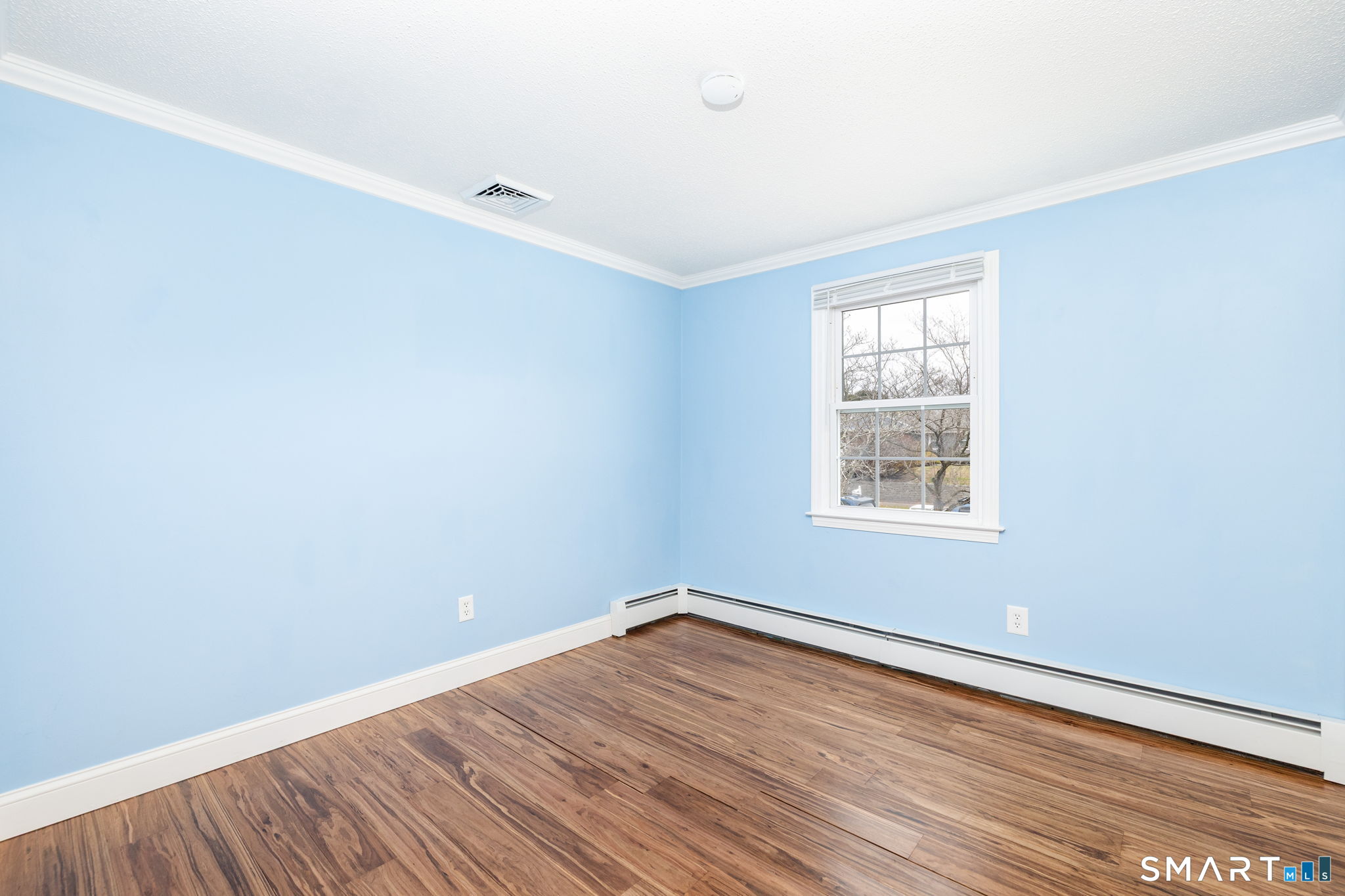 8 Still Field Road Manchester, CT 06040 - Photo 25 of 38 an empty room with wooden floor and windows