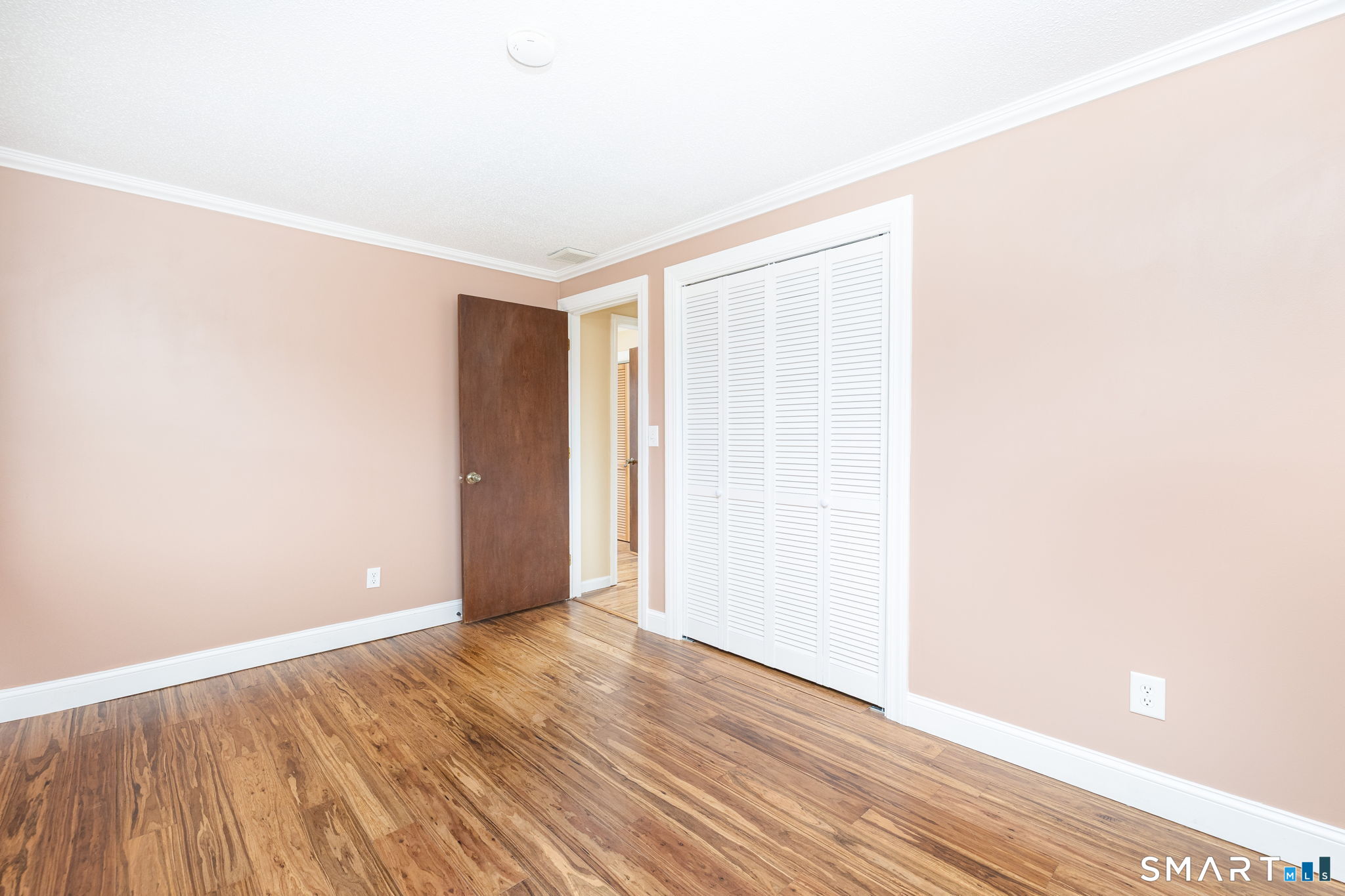 8 Still Field Road Manchester, CT 06040 - Photo 27 of 38 a view of an empty room with wooden floor