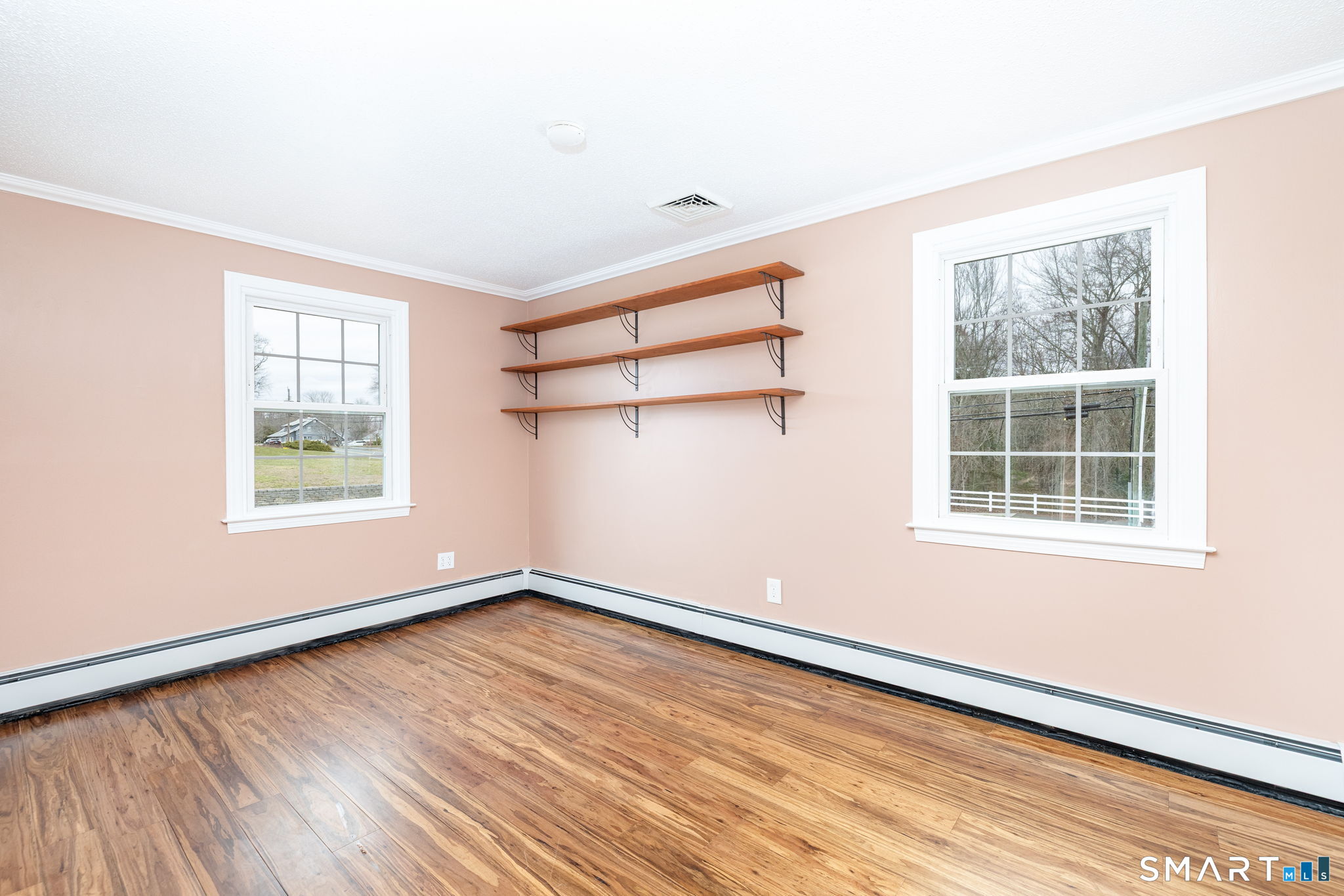8 Still Field Road Manchester, CT 06040 - Photo 28 of 38 an empty room with wooden floor and windows