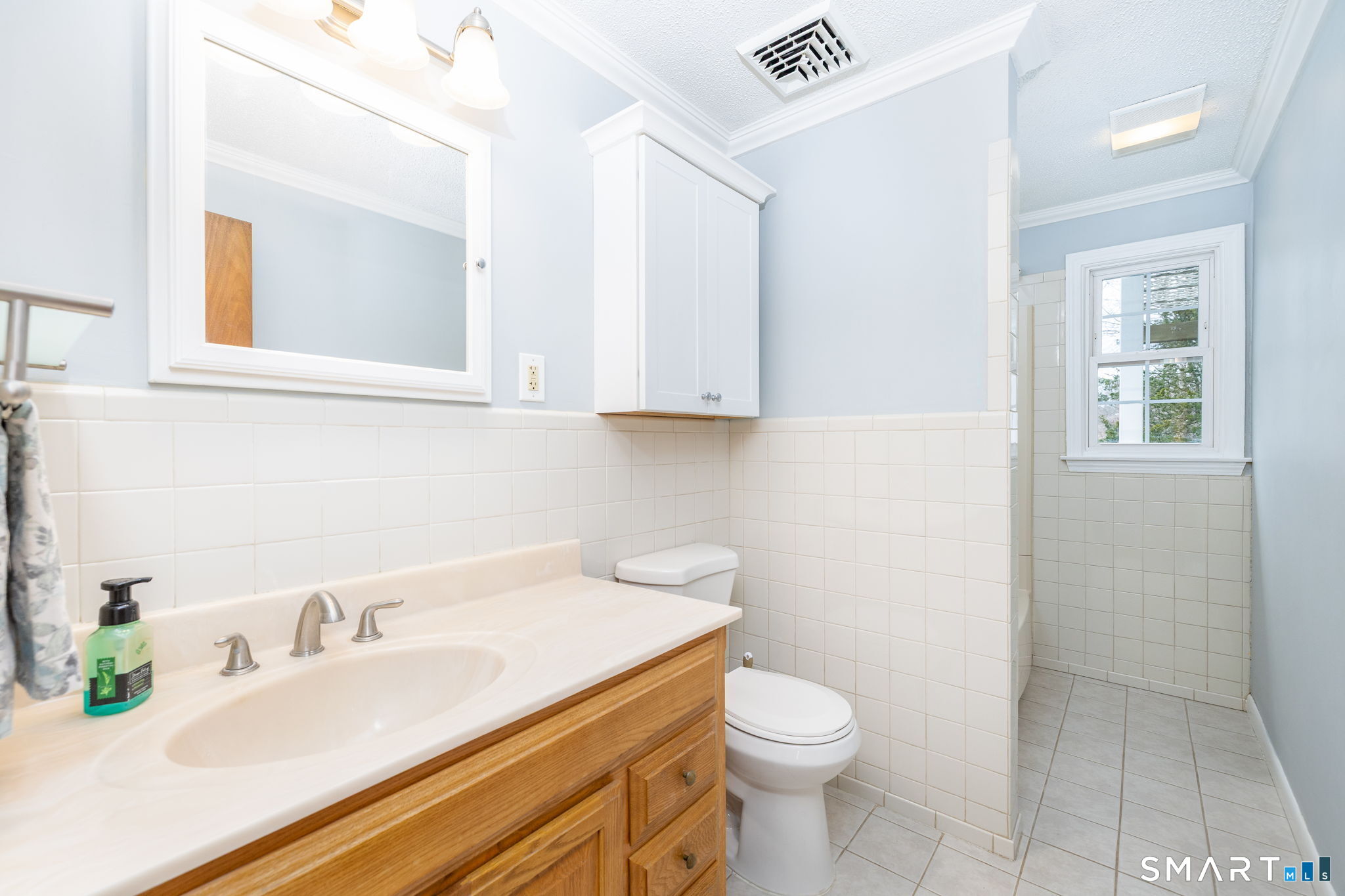 8 Still Field Road Manchester, CT 06040 - Photo 30 of 38 a bathroom with a granite countertop sink and a toilet