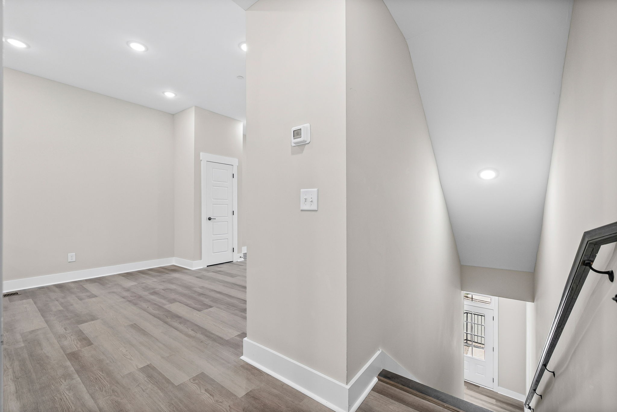 438 Centre Street Pleasant View, TN 37146 - Photo 16 of 44 a view of an empty room with wooden floor and stairs