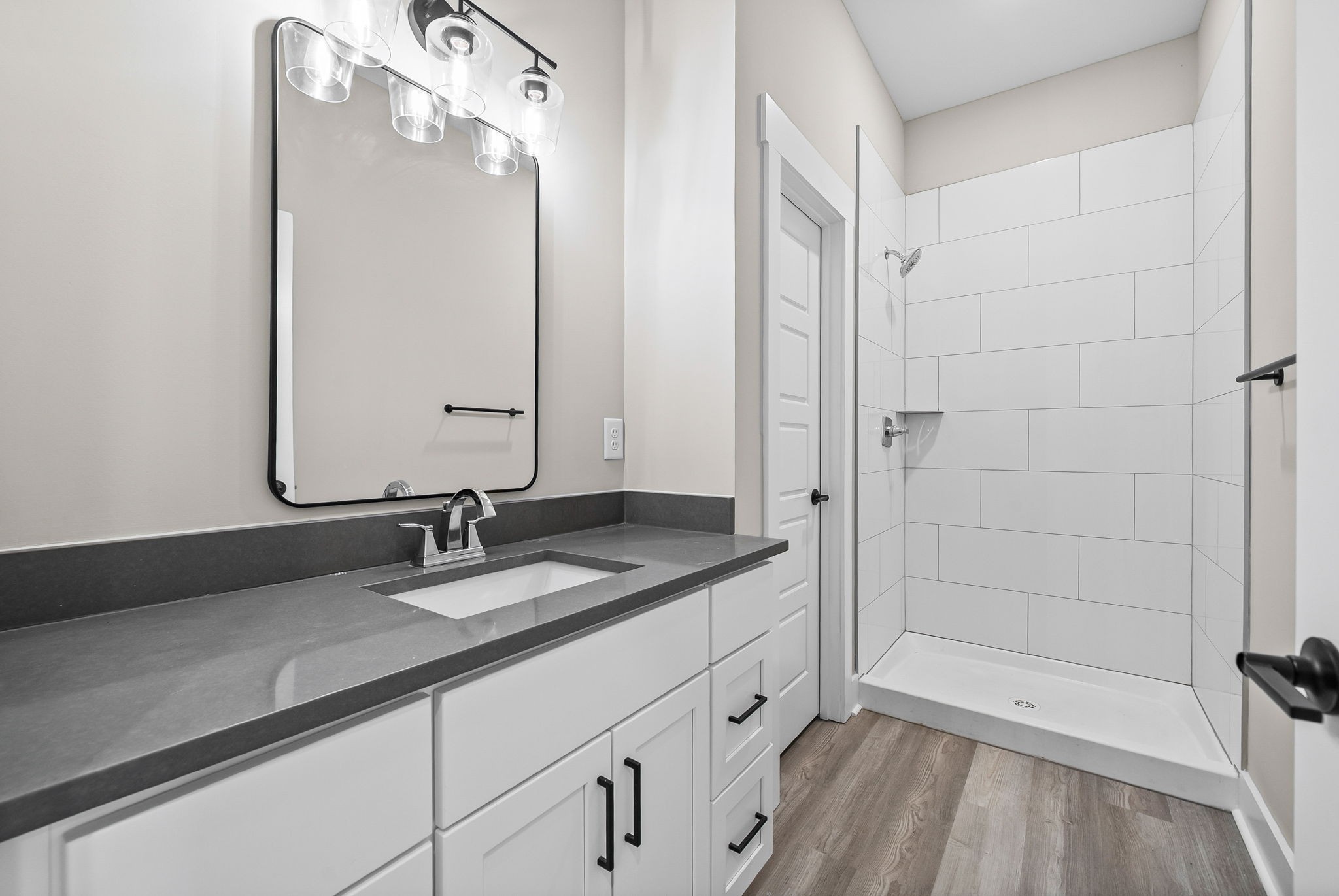 438 Centre Street Pleasant View, TN 37146 - Photo 34 of 44 a bathroom with a granite countertop sink a mirror and shower