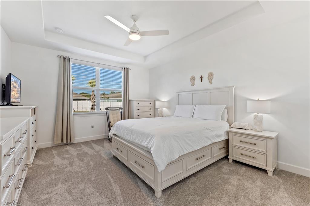 15850 Blue Rdg Way Punta Gorda, FL 33982 - Photo 11 of 23 a spacious bedroom with a bed and a window