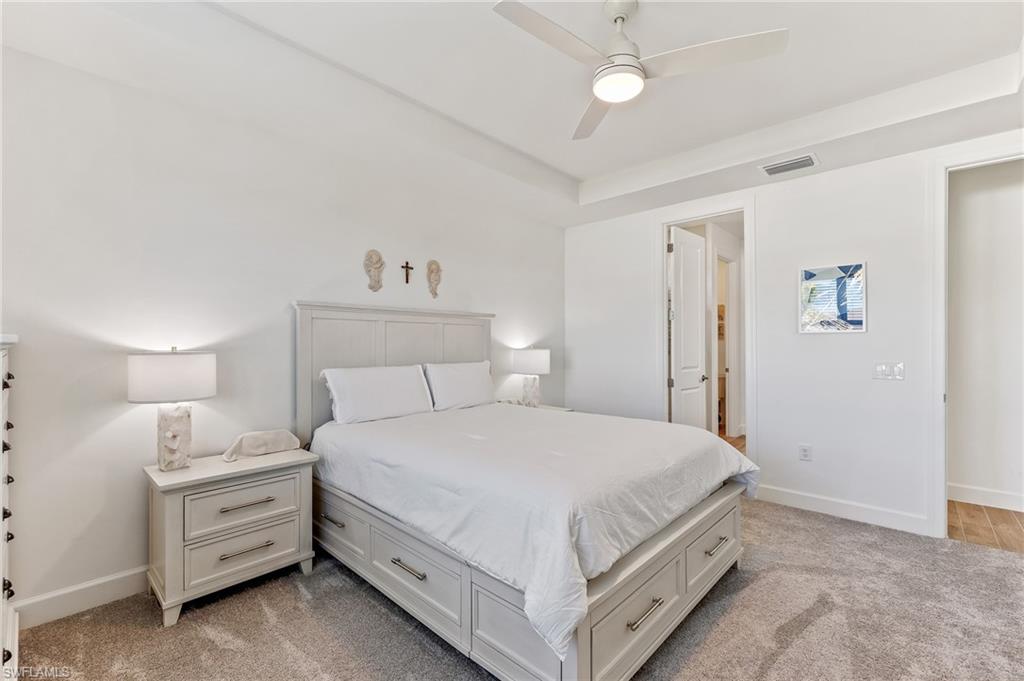 15850 Blue Rdg Way Punta Gorda, FL 33982 - Photo 12 of 23 a bedroom with a bed and a cabinets