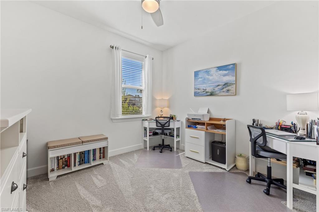 15850 Blue Rdg Way Punta Gorda, FL 33982 - Photo 13 of 23 a living room with furniture a window and a piano