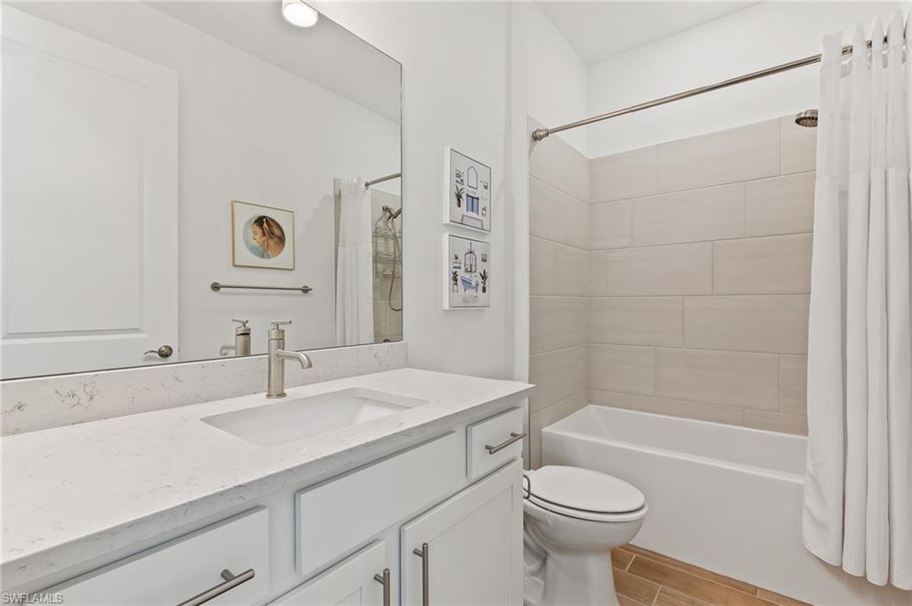 15850 Blue Rdg Way Punta Gorda, FL 33982 - Photo 15 of 23 a bathroom with a sink toilet and shower