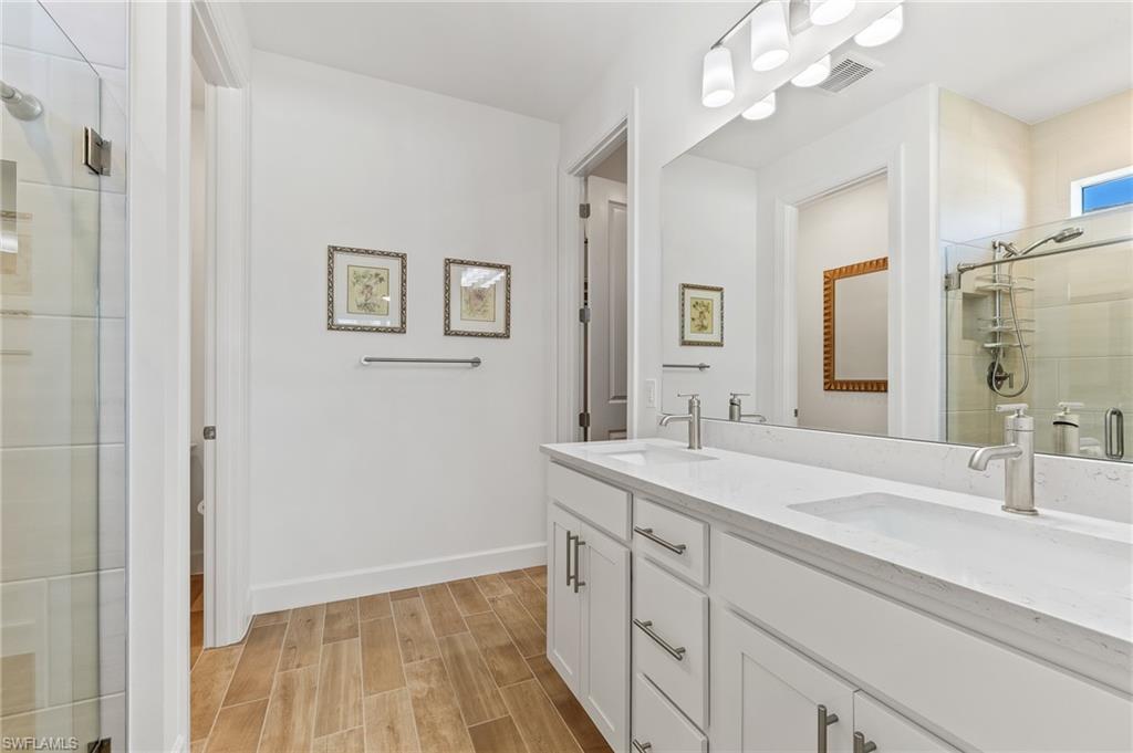 15850 Blue Rdg Way Punta Gorda, FL 33982 - Photo 16 of 23 a bathroom with a sink a vanity and a mirror