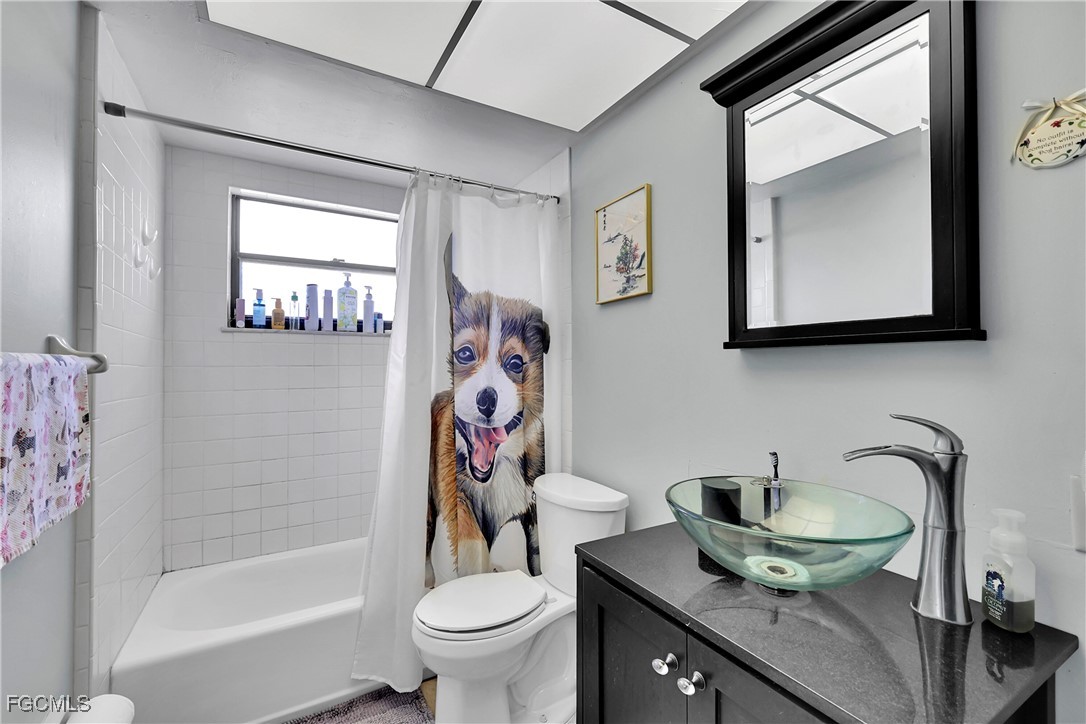 19165 Coconut Road Fort Myers, FL 33967 - Photo 11 of 27 a bathroom with a toilet sink and mirror