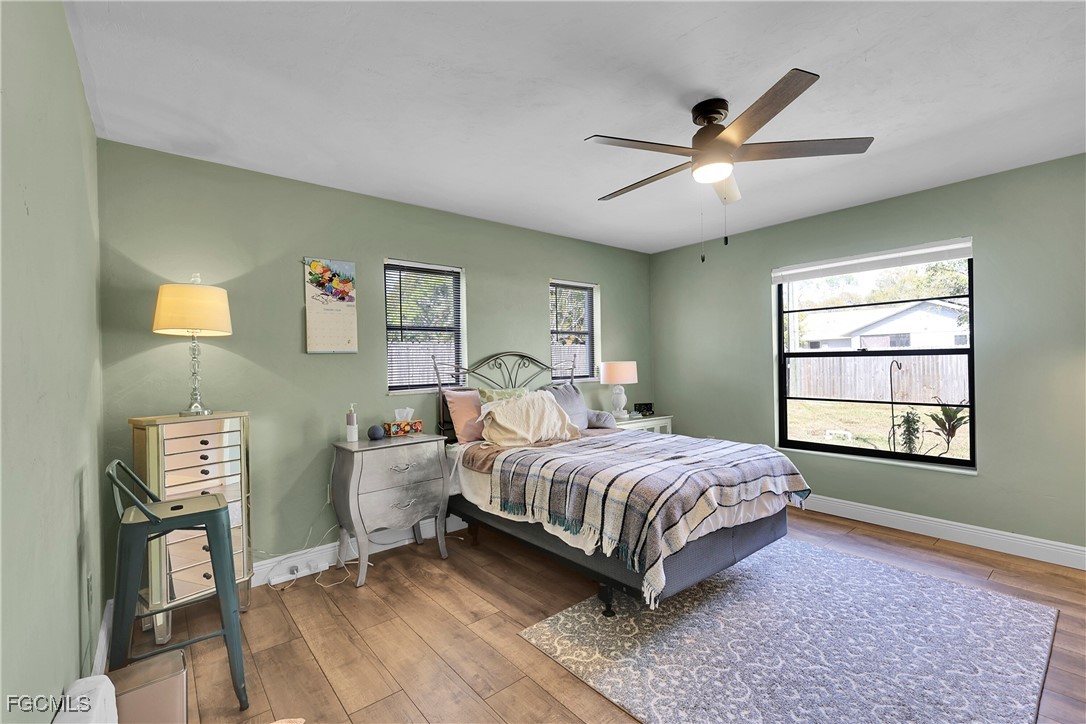 19165 Coconut Road Fort Myers, FL 33967 - Photo 13 of 27 a living room with a bed furniture and a window