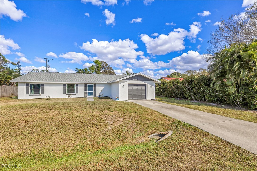 19165 Coconut Road Fort Myers, FL 33967 - Photo 2 of 27 a front view of a house with yard