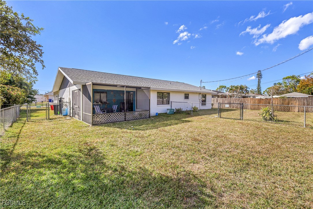 19165 Coconut Road Fort Myers, FL 33967 - Photo 24 of 27 a view of a house with a yard