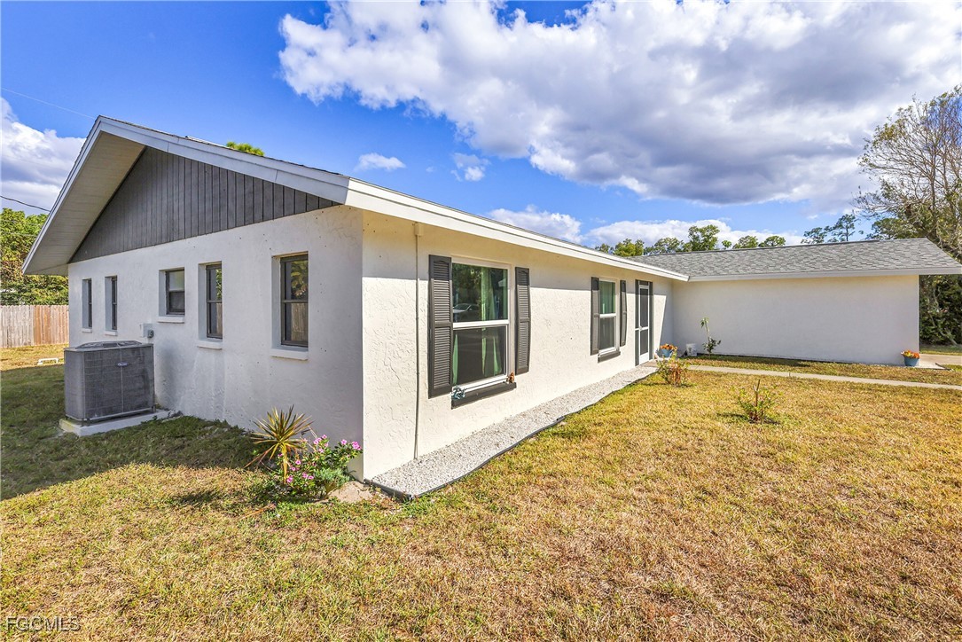 19165 Coconut Road Fort Myers, FL 33967 - Photo 26 of 27 a view of a house with a yard