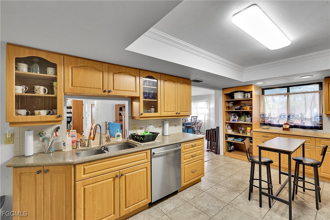 19165 Coconut Road Fort Myers, FL 33967 - Photo 8 of 27 a kitchen with stainless steel appliances granite countertop a sink and cabinets