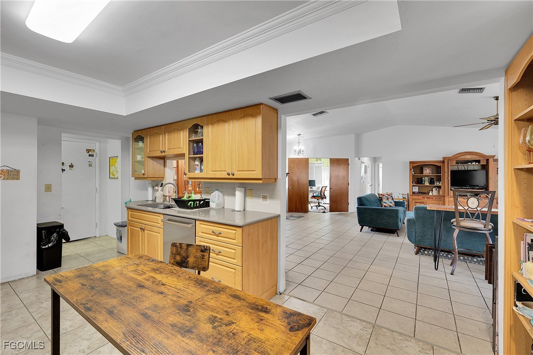 19165 Coconut Road Fort Myers, FL 33967 - Photo 10 of 27 a large kitchen with a table and chairs in it