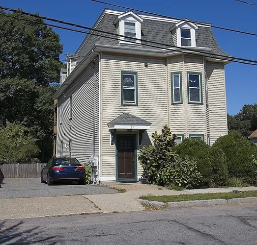 a front view of a house with a garage