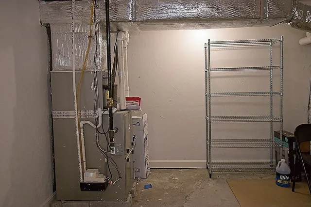 a view of a storage & utility room with closet