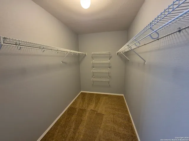 a view of a room with racks on the wall