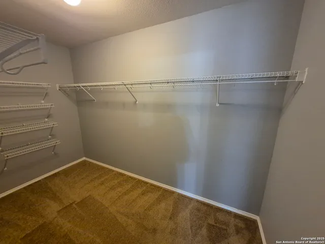 a view of an empty walk in closet