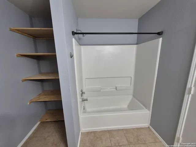 a bathroom with a bathtub