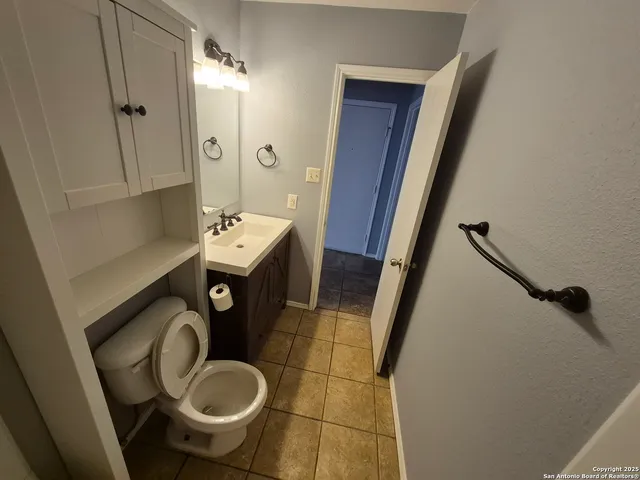 a bathroom with a sink and toilet