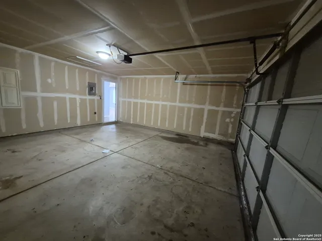 a view of an empty room with stairs