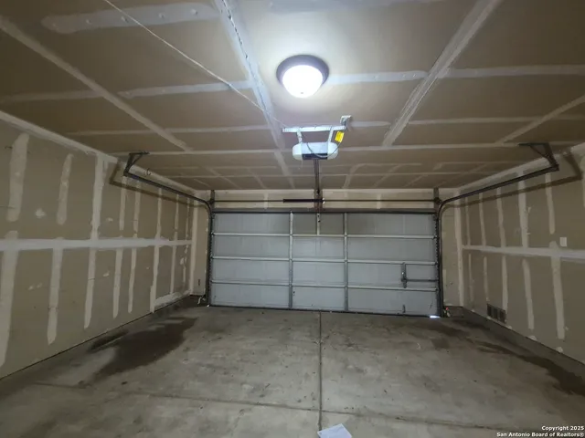 a view of a garage with racks on the wall