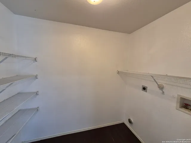 a view of small space with racks on the wall