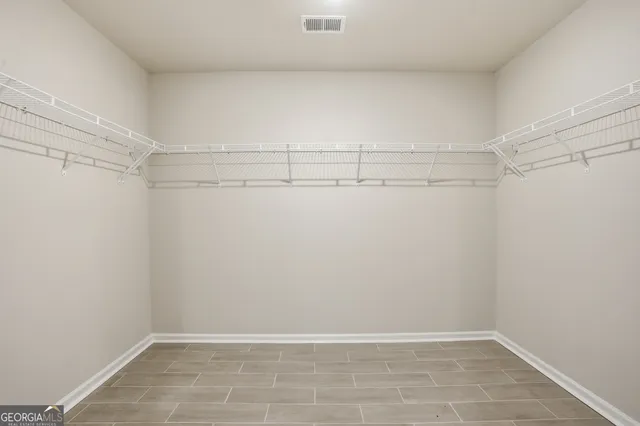 a view of an empty walk in closet