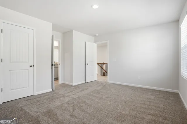 a bathroom with a sink toilet and a mirror