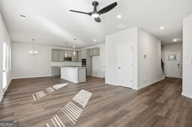 a view of kitchen with wooden floor and window