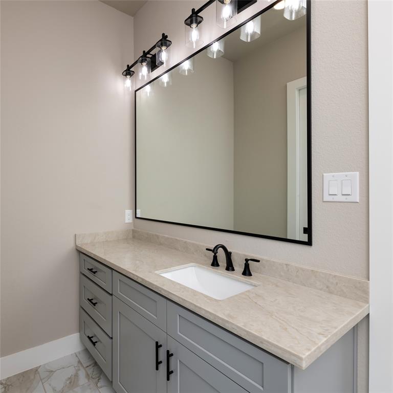 217 Fm 2258 Venus, TX 76084 - Photo 28 of 36 a bathroom with a granite countertop sink and mirror